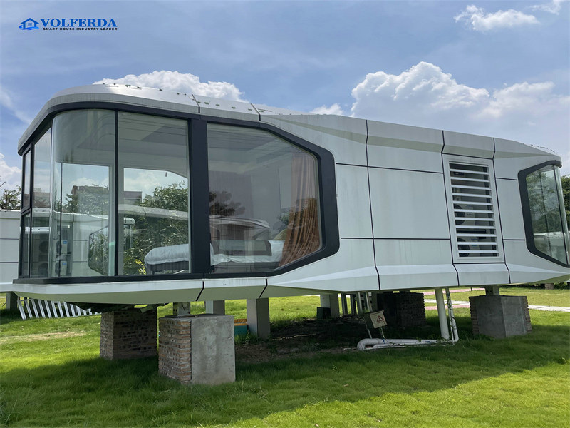 capsule tiny house with panoramic glass walls