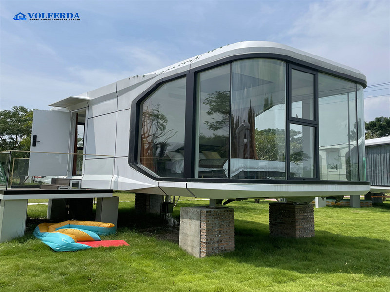Pre-assembled prefabricated glass house with home office elements